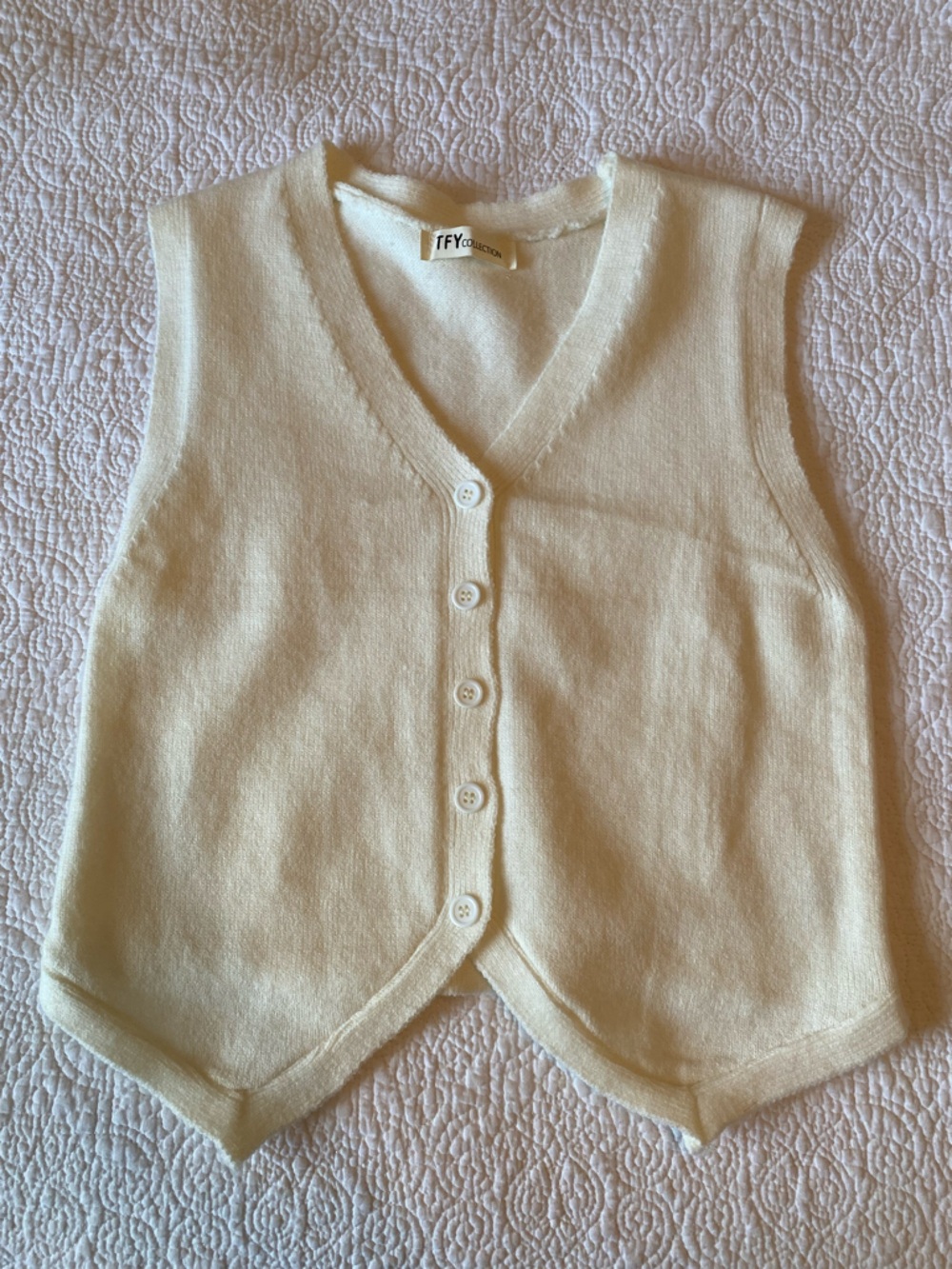 Cream sweater vest